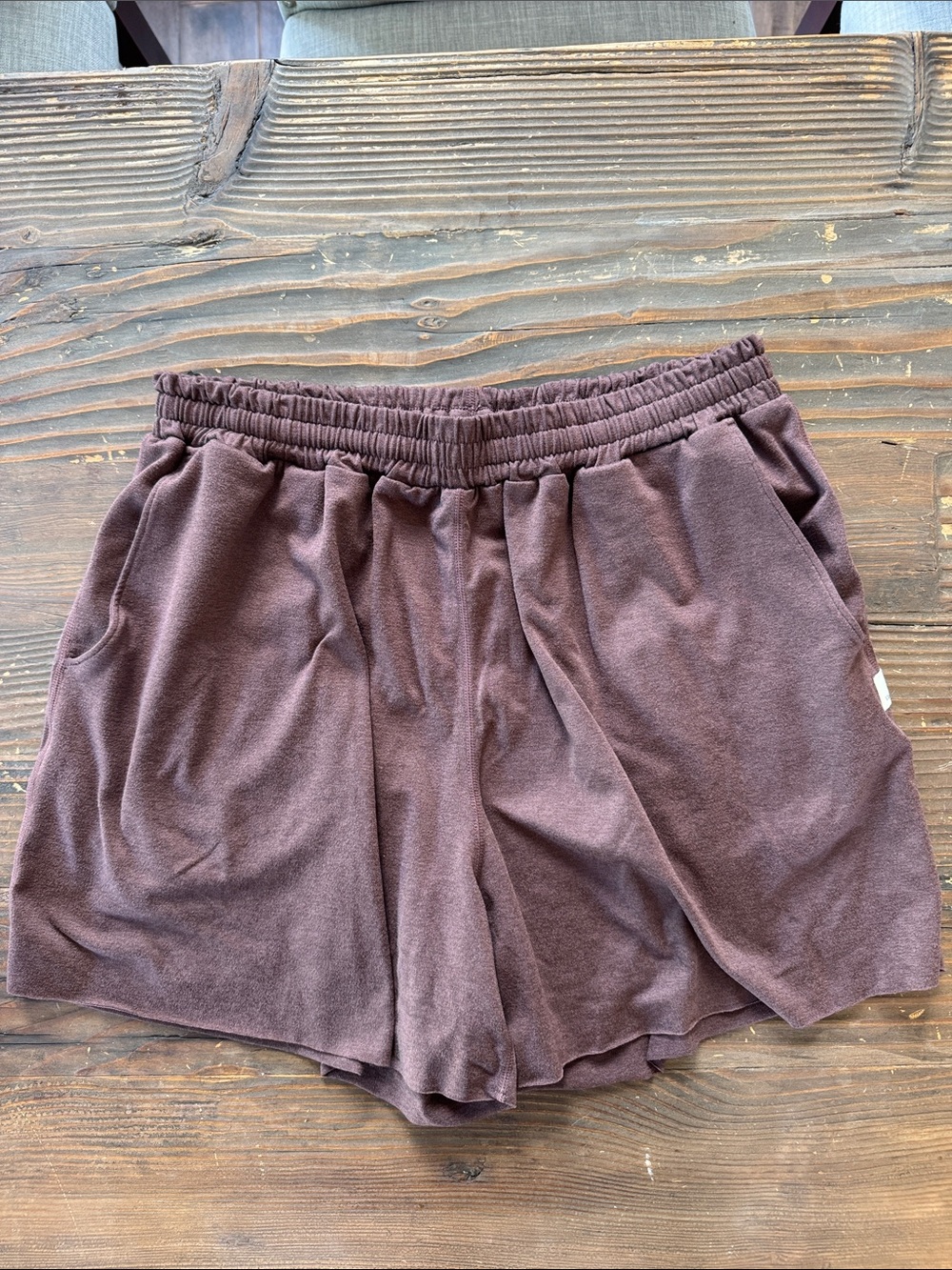 Vuori Women's Relaxed Elastic-Waist Brown Shorts with drawstring.